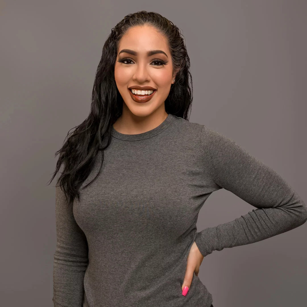 Beautiful young Hispanic woman smiling with white teeth
