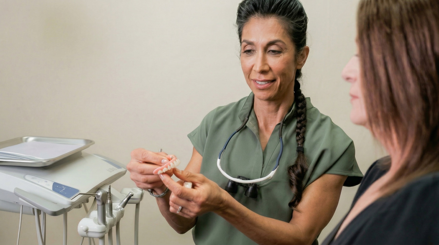 Dr. Pournik giving a patient a consultation